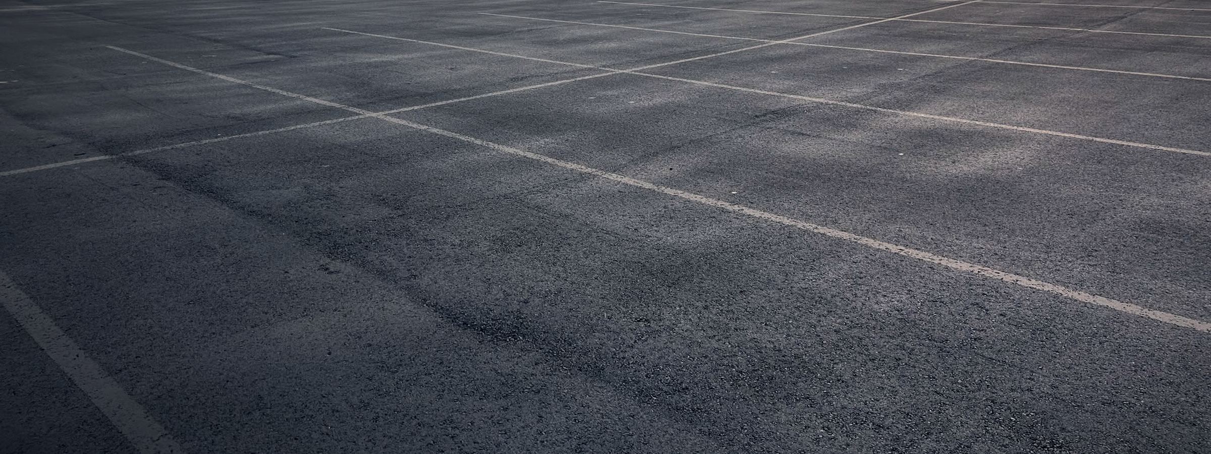 Freshly sealed and striped commercial parking lot in the Oklahoma City metro