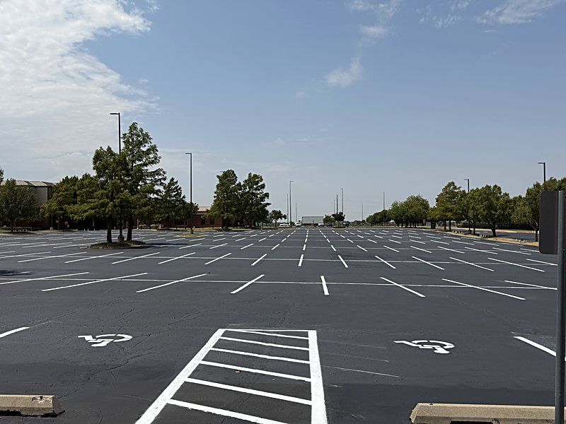 Freshly painted ADA stalls and access aisle on a large commercial lot