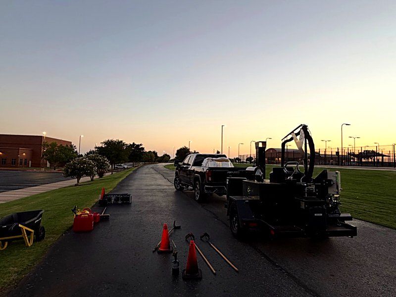 Heartland equipment staged for an early-morning lot closure